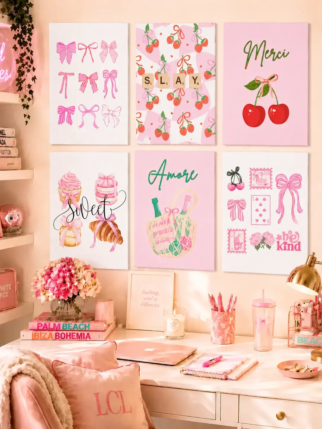Preppy pink 6-piece canvas gallery wall art bundle by Doodles and Saffron with bow, cherry, sweet pastry, and Amore picnic prints over a desk.