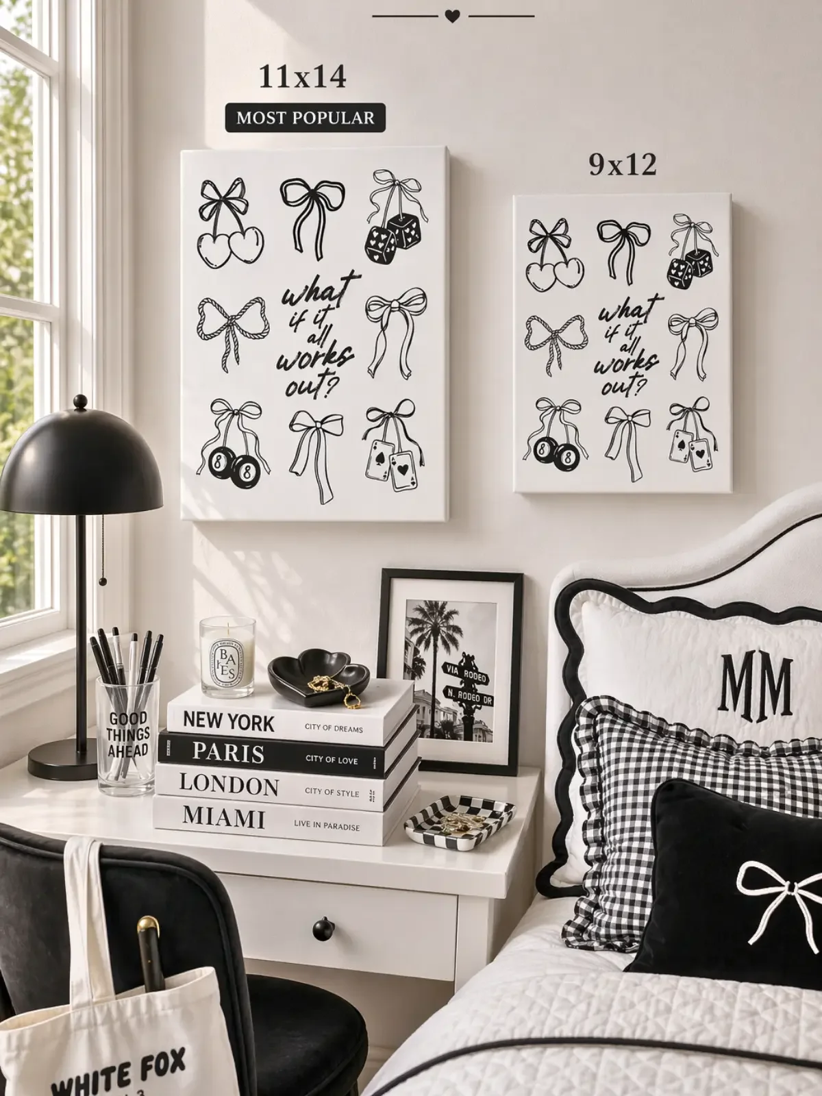 Size guide for Doodles and Saffron comparing 11x14 and 9x12 inch black and white coquette bow canvas prints on a soft wall.
