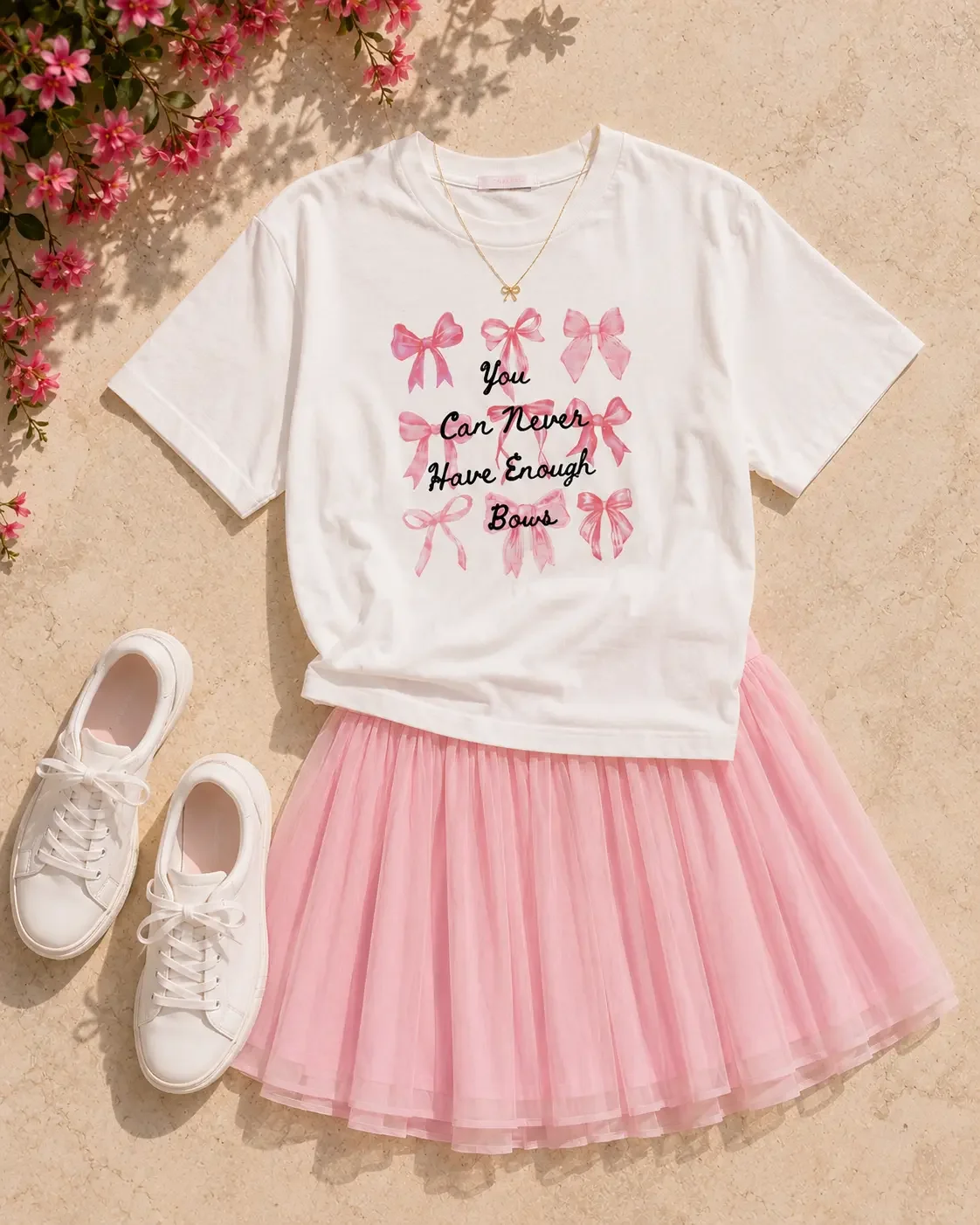 never-enough-bows-tshirt-pink-skirt-outfit-flatlay.webp