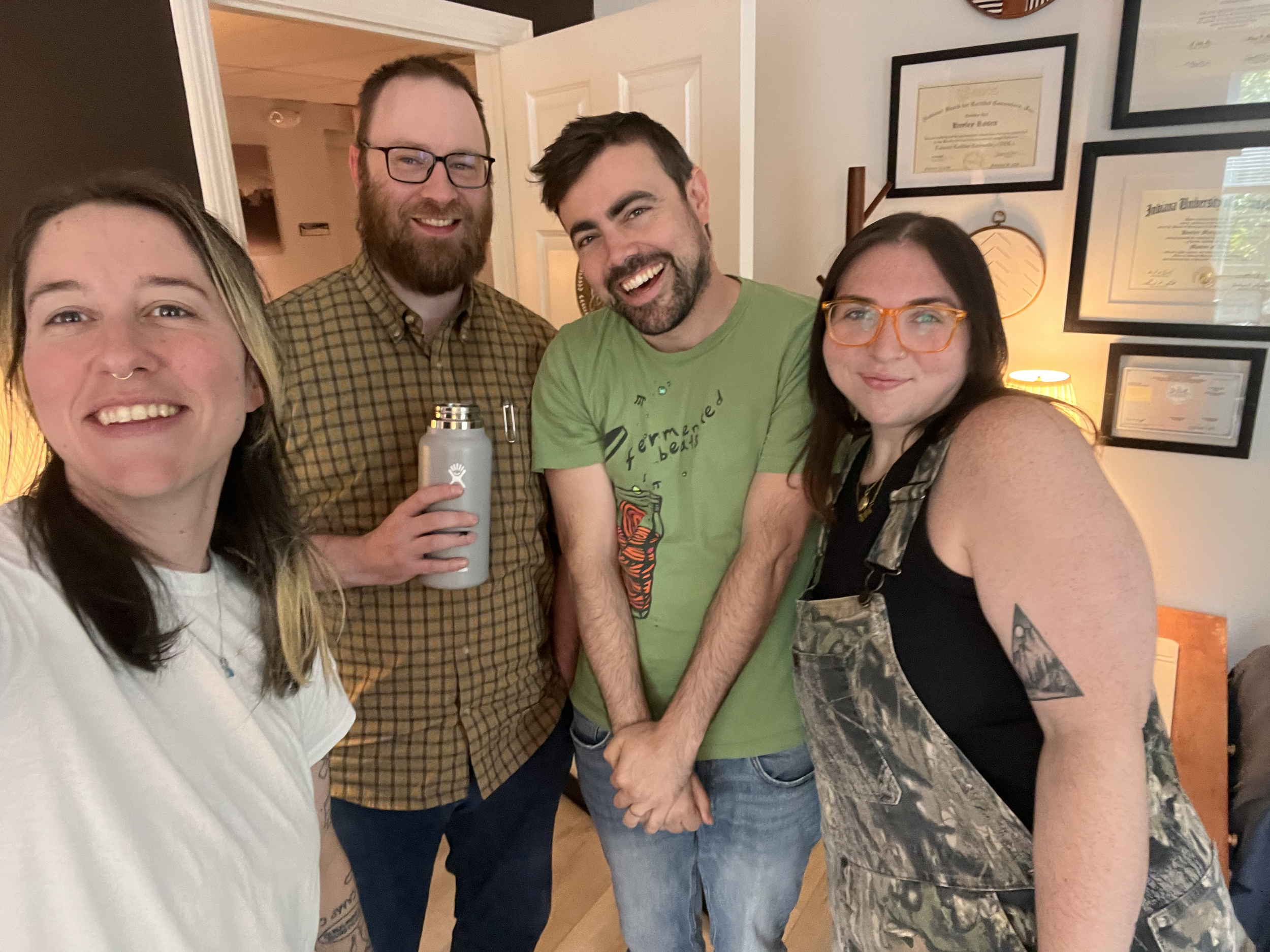 A group of therapists standing together indoors, smiling and posing for a selfie.
