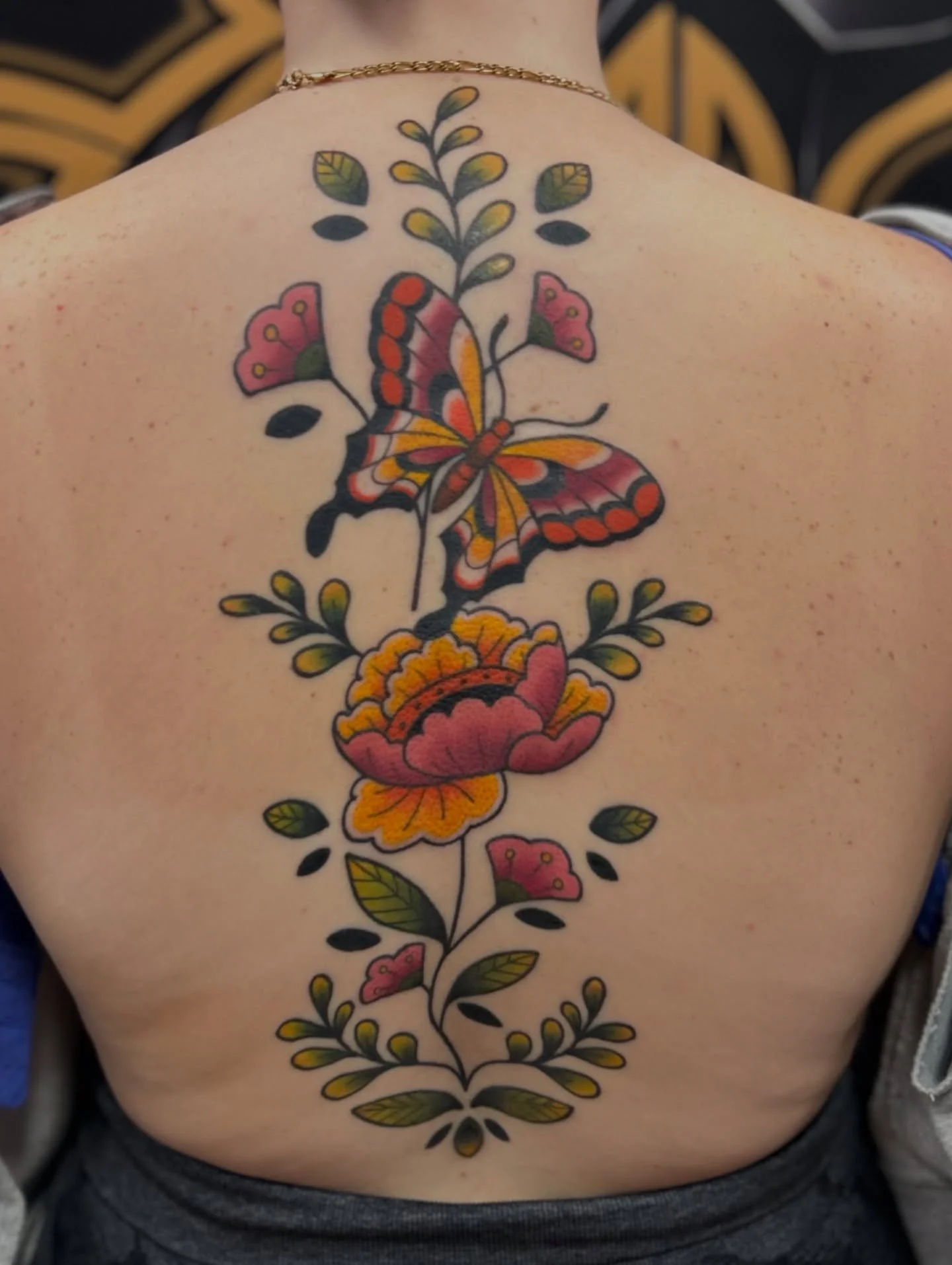 Shout out to @katie_demaio for being a trooper through this. My biggest tattoo yet! 🫡

There&rsquo;s a couple shiny spots still healing, but I&rsquo;m too stoked to wait to post it. Fresh shading on the big flower and butterfly 🖤

#tattoo #traditio