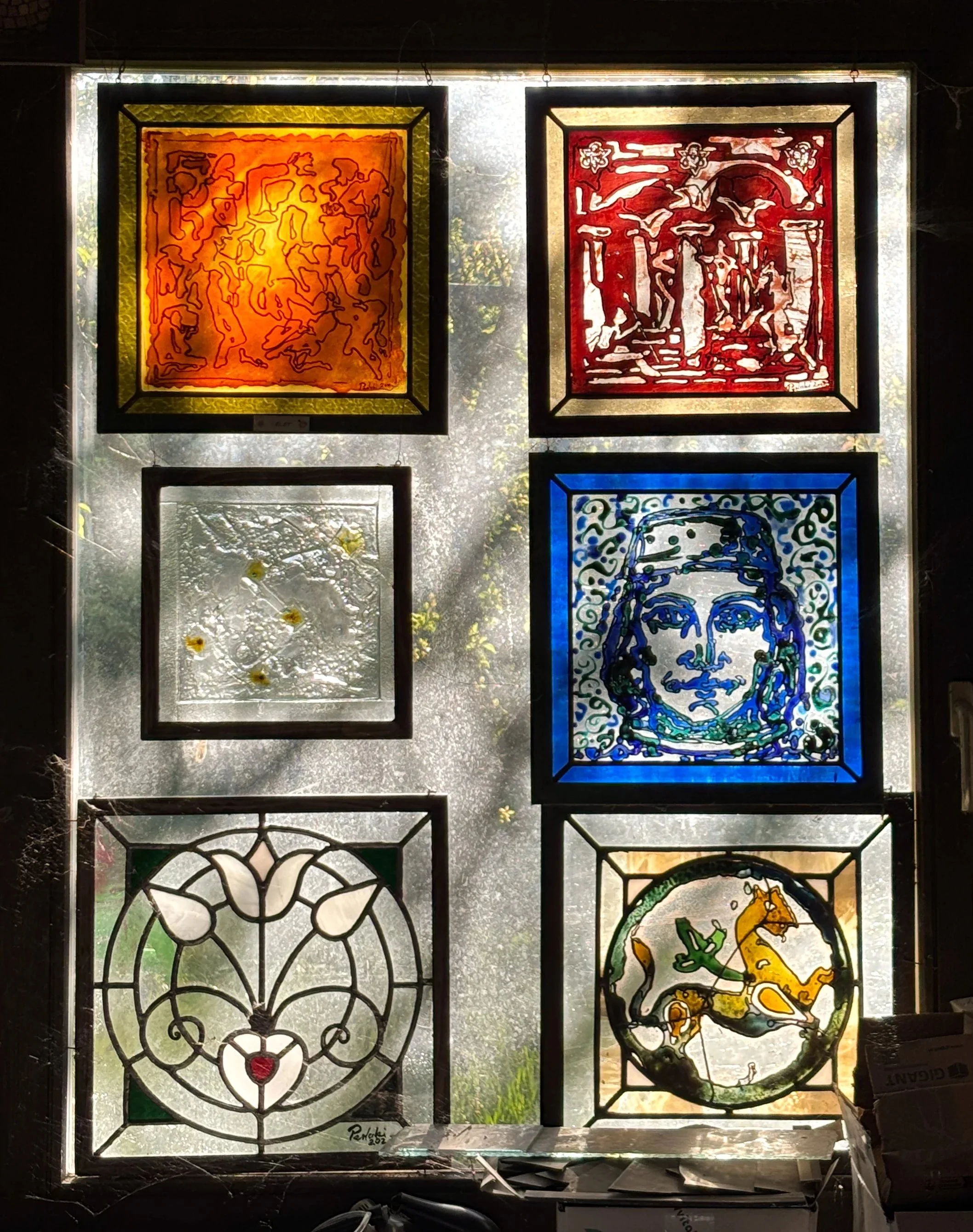 A classic view in the atelier: echoes of Tuscany, motifs taken from the Duomo in Ferrara, and a stylised flower.