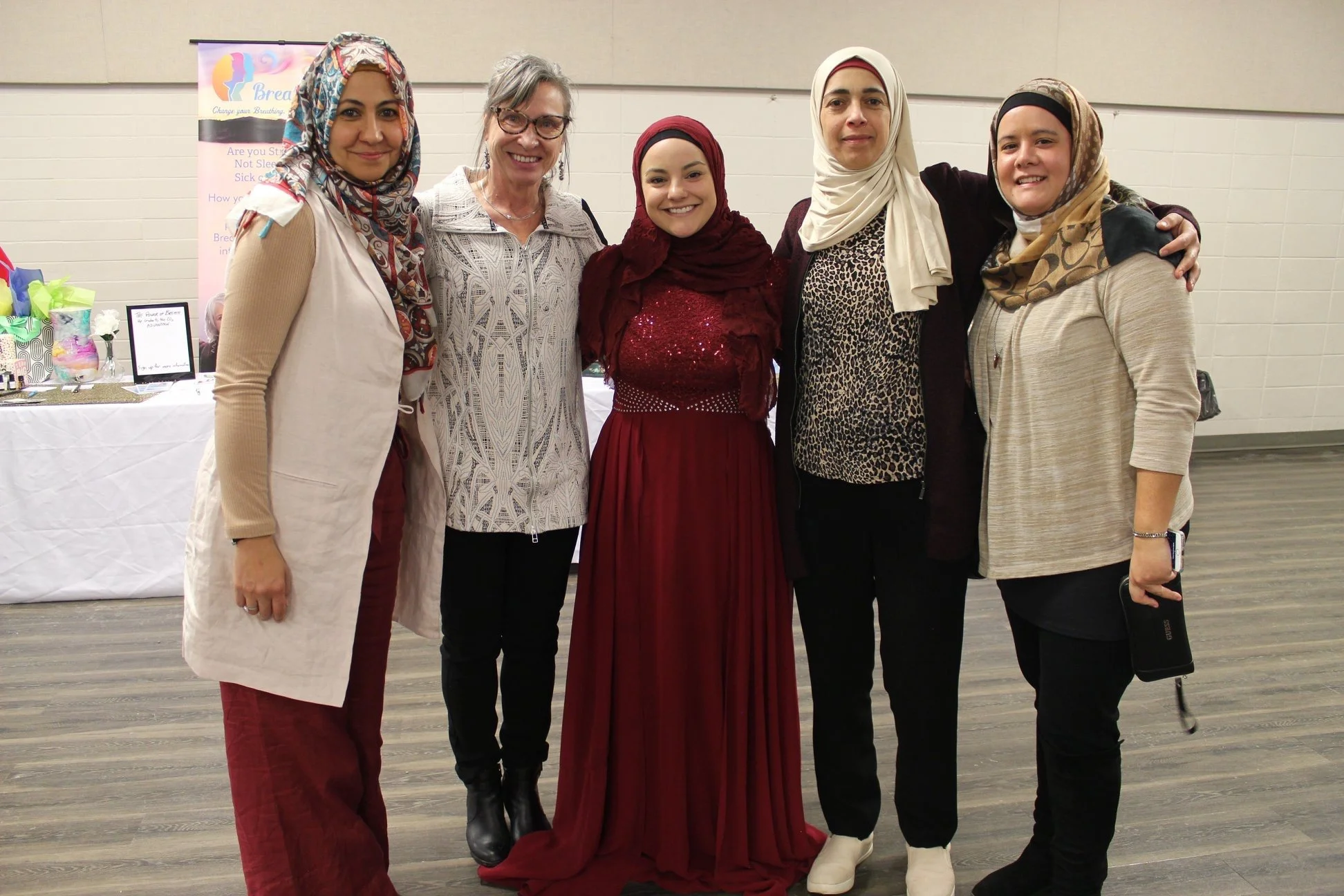 Vendors and host Khadijah Layla gather for self-portrait with Muslim artists at event in Calgary
