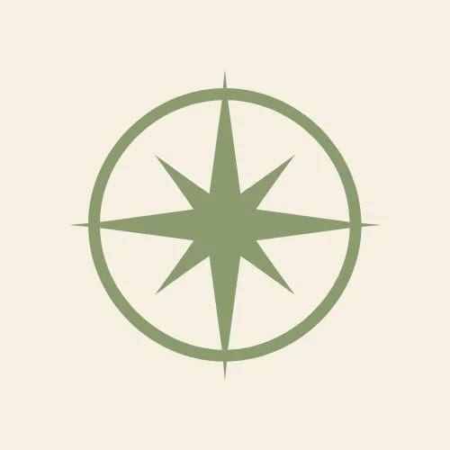 Green compass rose symbol on a light beige background.