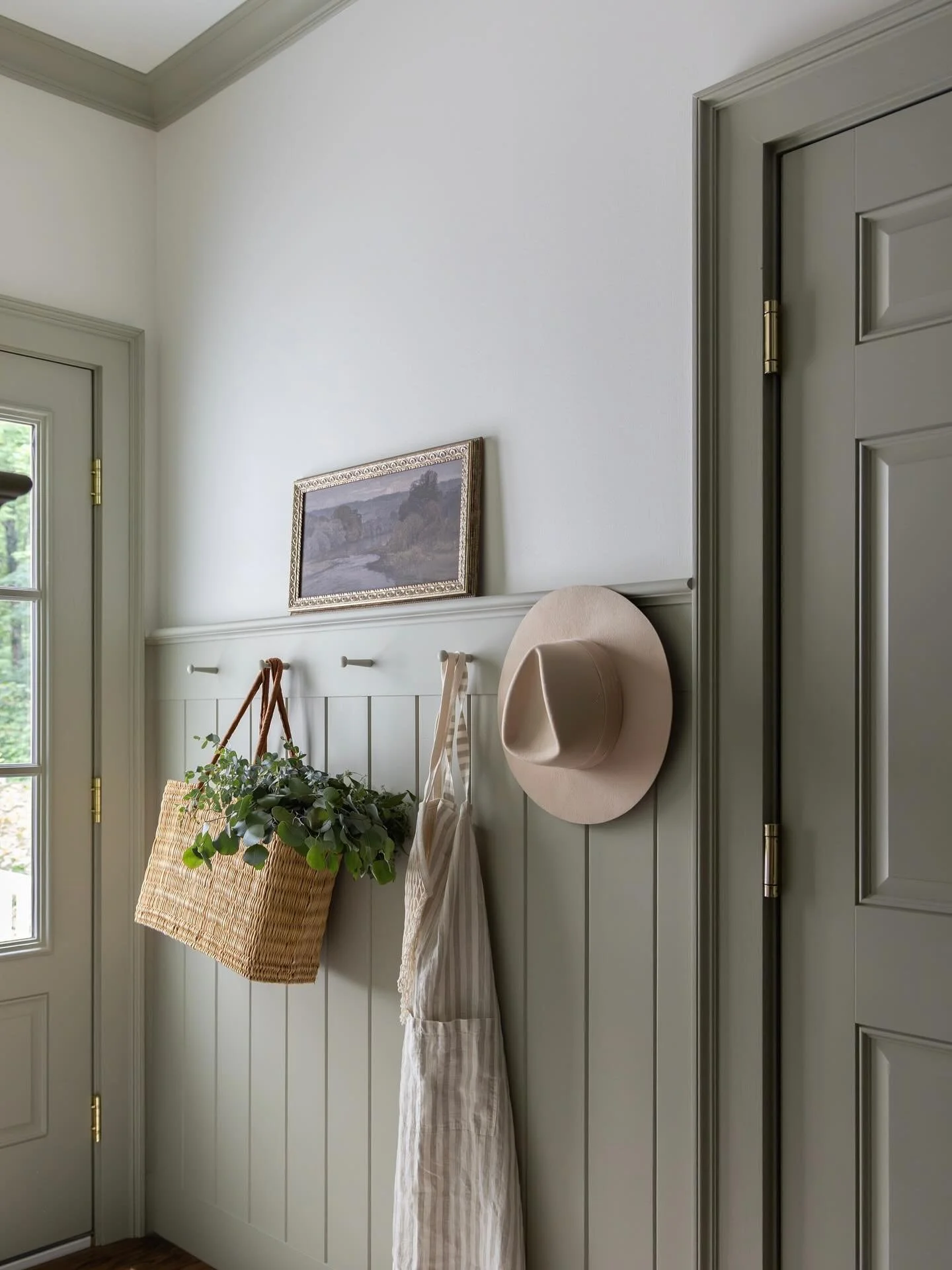 Where beauty meets utility.... This mudroom is all about thoughtful storage, durable soapstone counters, and tongue-and-groove walls wrapped in the dreamiest soft sage paint by @farrowandball. Proof that even the most hardworking spaces deserve to be