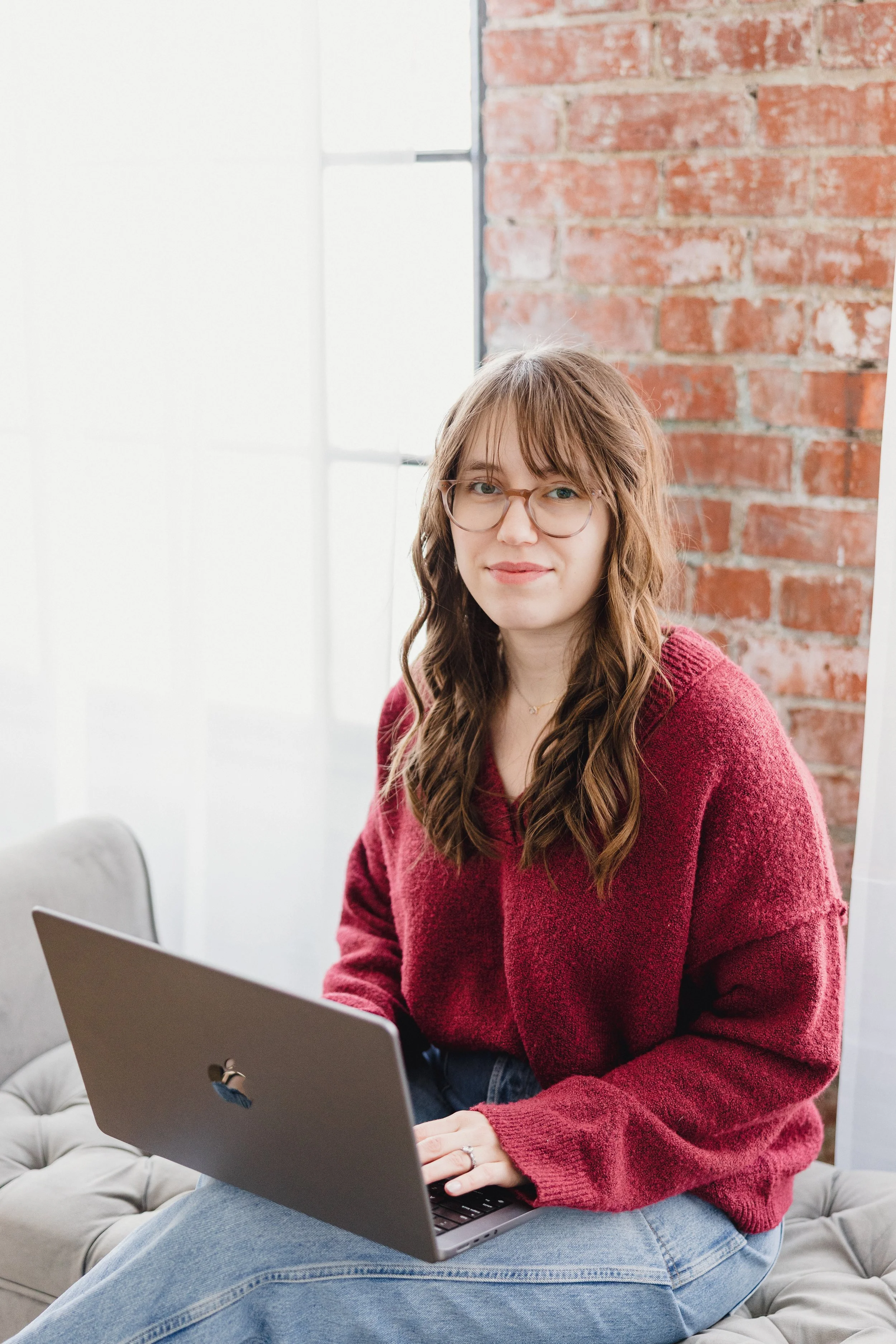 Dietitian sitting with laptop, representing accessible virtual nutrition counseling for pregnancy and postpartum