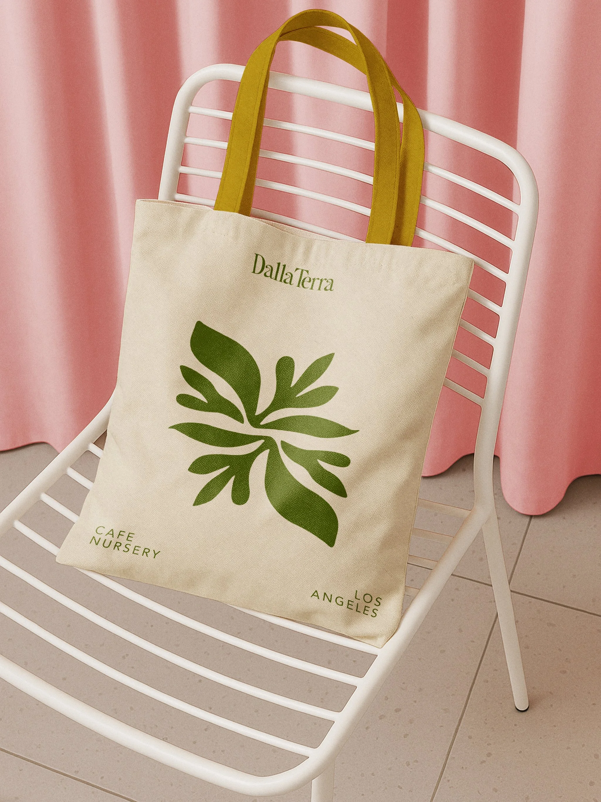 tote-bag-mockup-on metail-chair-front-view.jpg