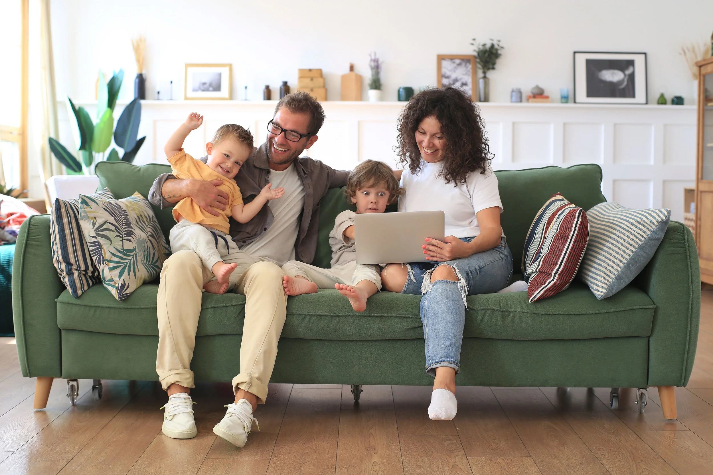 Family relaxing on a freshly cleaned sofa in their home in Preston