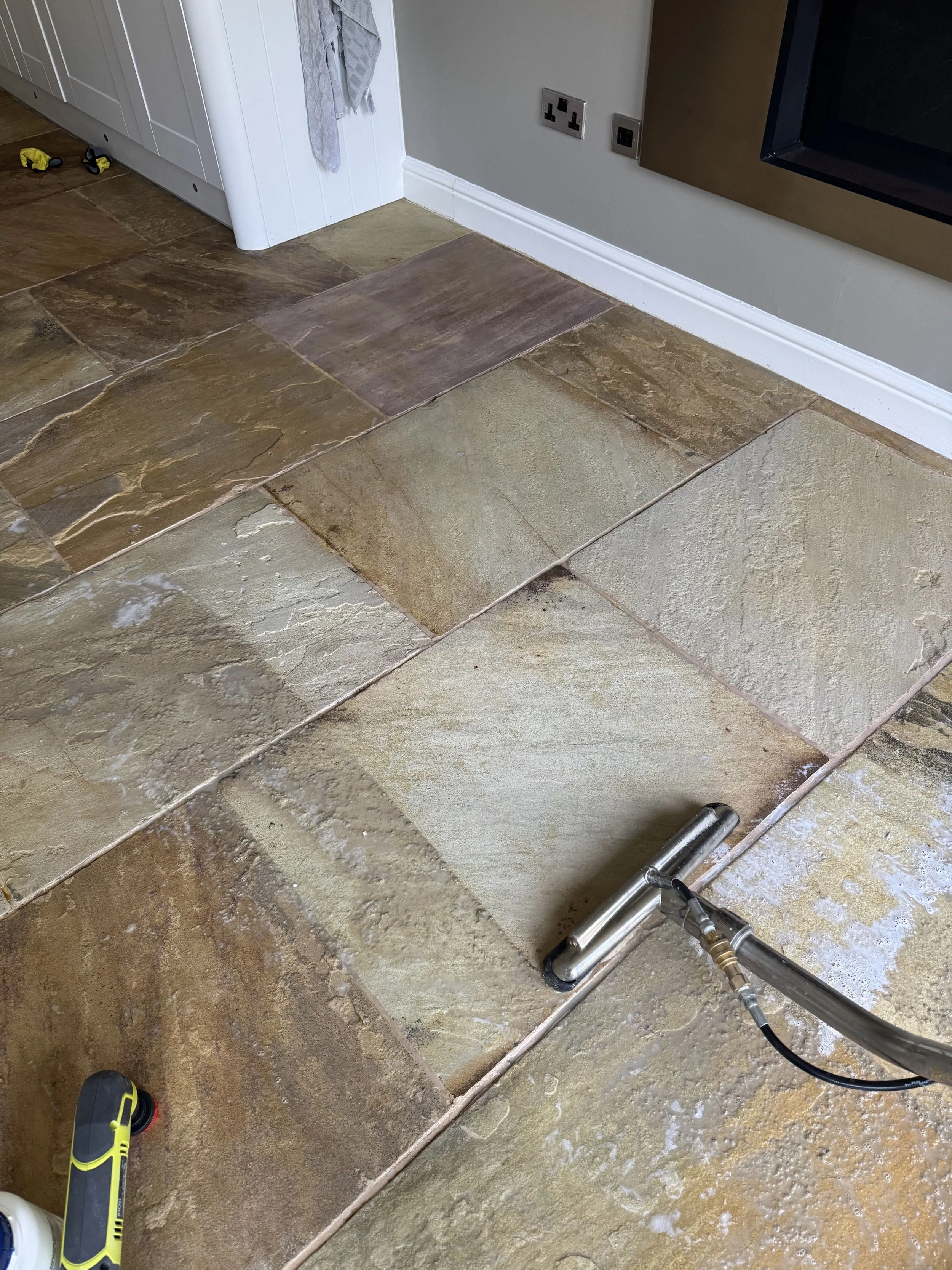 Flagstone cleaning and restoration during process.