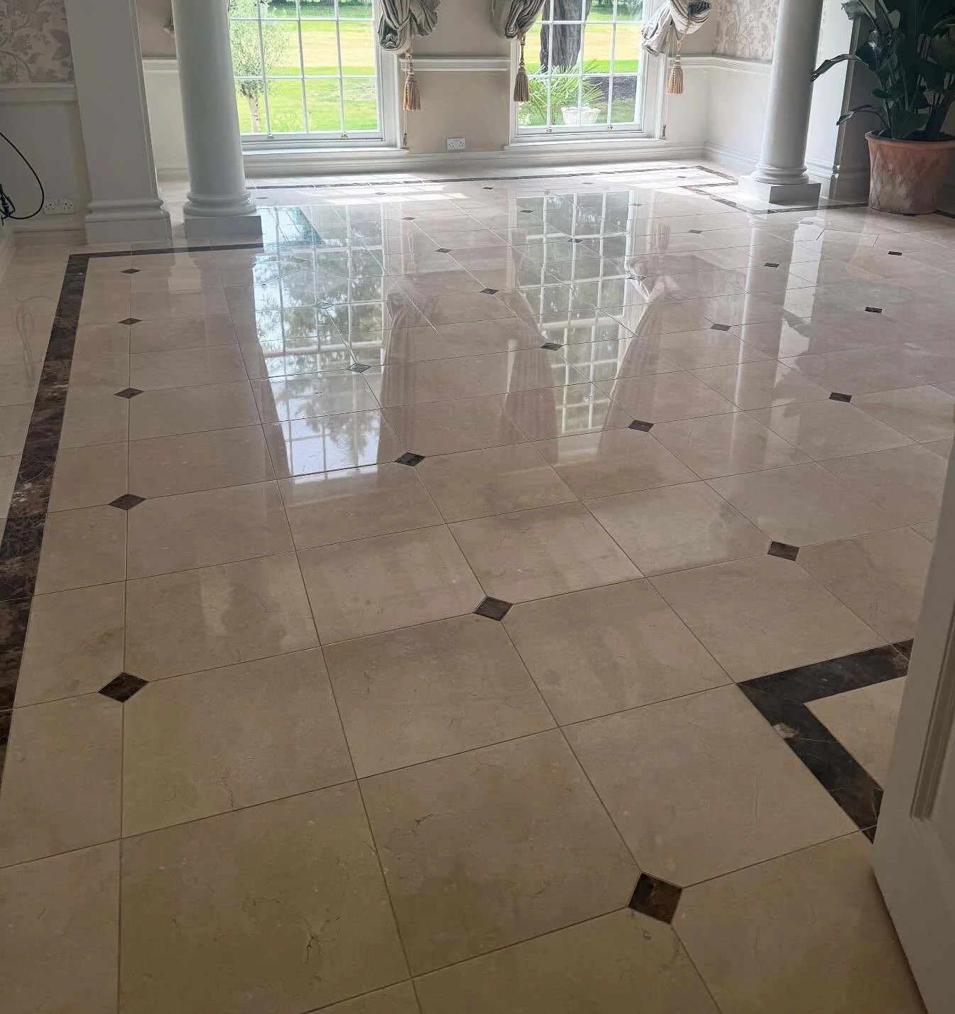 Shiny natural stone floor in Blackpool home after a full clean and restoration
