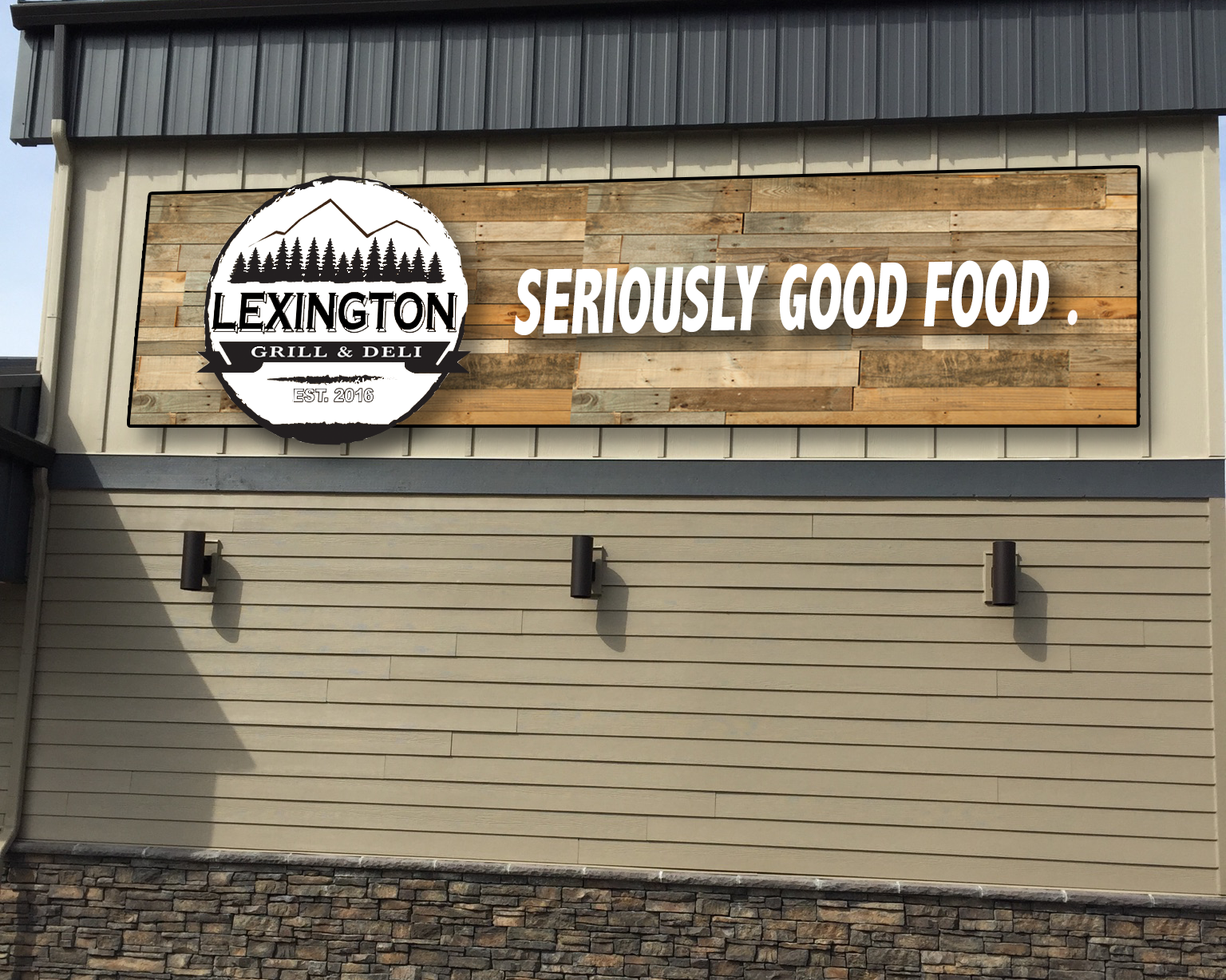 Exterior sign for Lexington Grill & Deli with the slogan 'Seriously Good Food' on a wooden background, established in 2016.