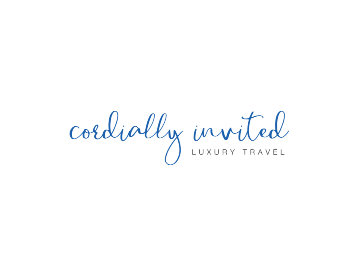 Logo for Cordially Invited Luxury Travel, featuring elegant script font in blue with black and gray accents.