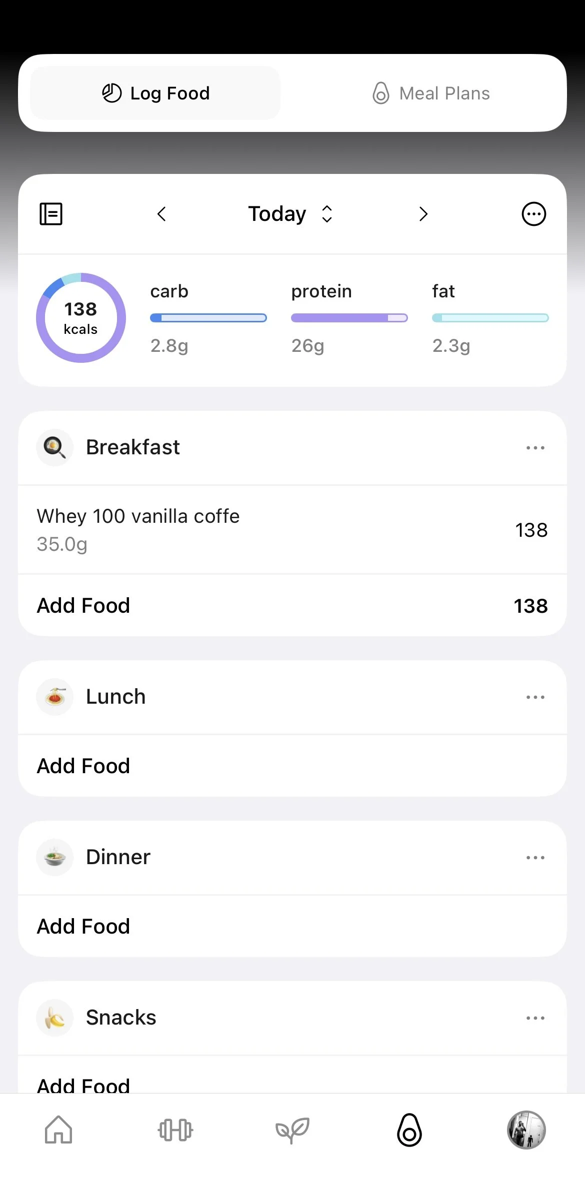 Screenshot of a food tracking app displaying daily nutrition intake. Shows 138 calories consumed from breakfast, specifically whey protein vanilla coffee, with macronutrient breakdown of 2.8g carbs, 26g protein, and 2.3g fat. Section for adding meals for lunch, dinner, and snacks is included.