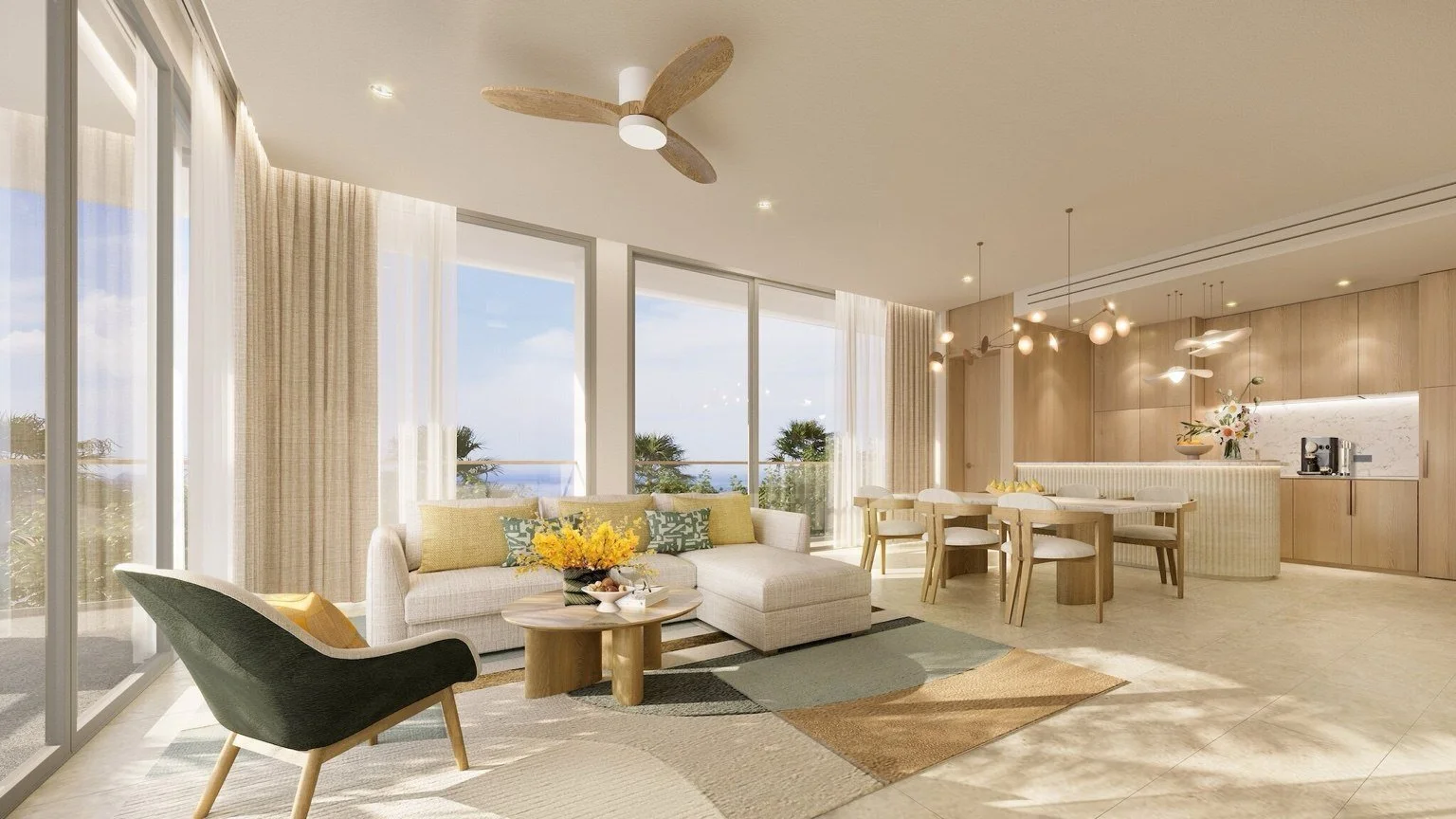 Bright living room in a Gardens of Eden Phuket residence with large windows, soft neutral furnishings, and views towards Bang Tao coastline.