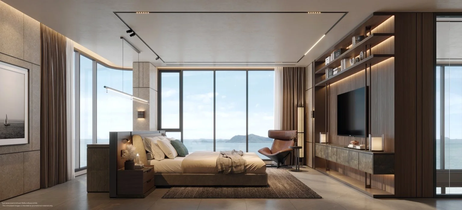 Penthouse master bedroom with floor-to-ceiling windows overlooking the sea at The Panora Estuaria.