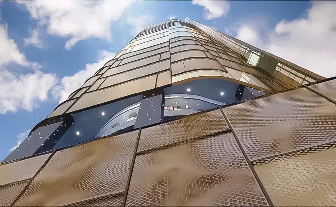 Exterior façade of Orion Residence Kuala Lumpur in daylight showing gold and glass detailing.