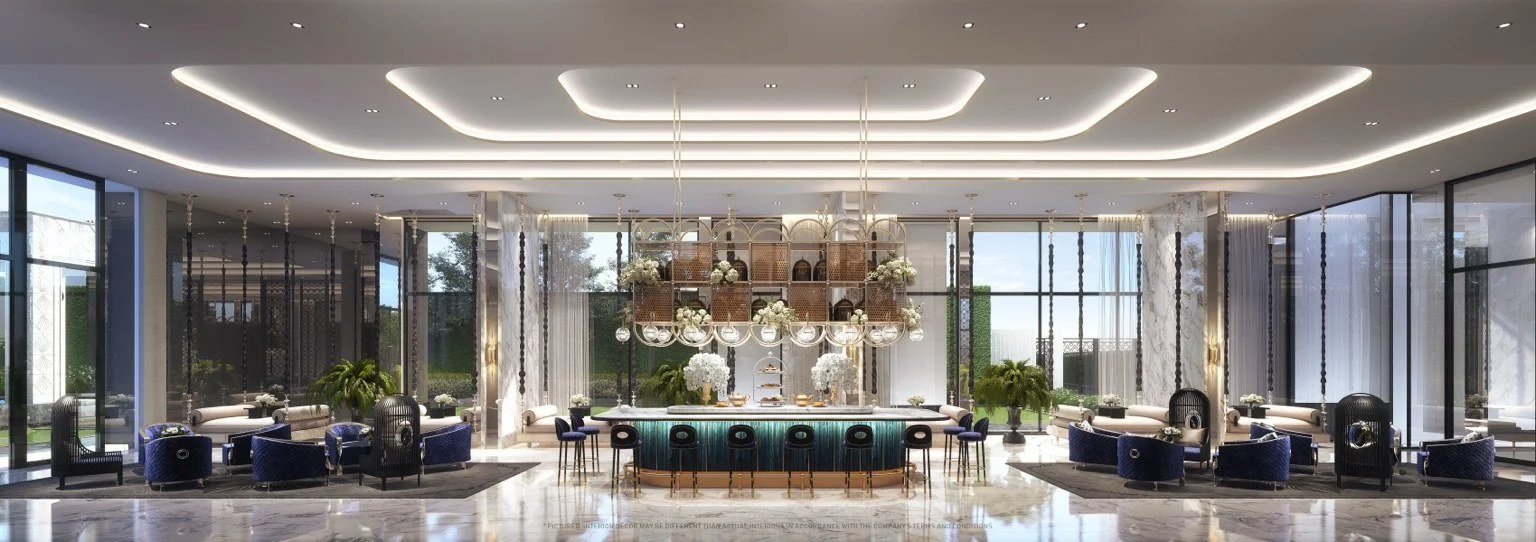 Grand lounge at The Address Siam–Ratchathewi featuring The Blue Saloon with refined seating, marble finishes and central bar.