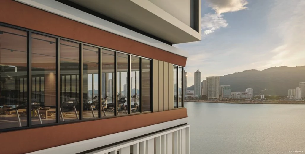 Gymnasium with panoramic waterfront views at Maris Penang.