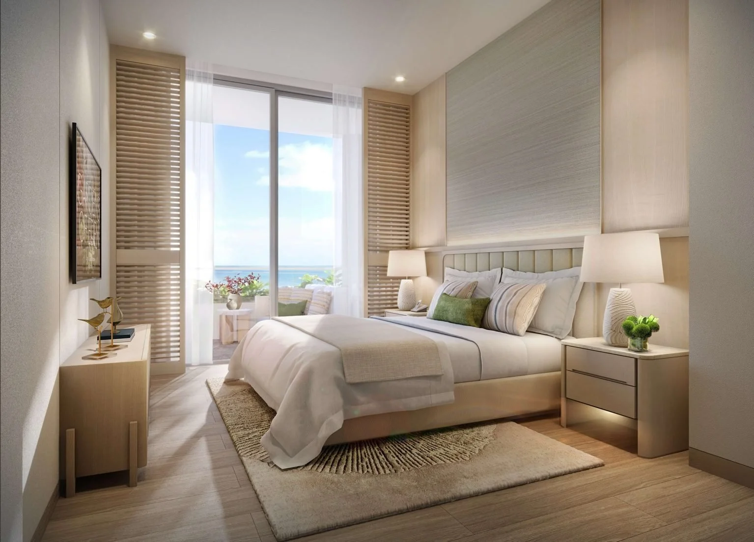 Master bedroom in a Gardens of Eden Phuket residence with king bed, soft lighting, and balcony doors framing a sea view.