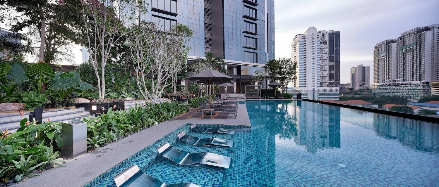 Infinity swimming pool with city skyline views at The Astaka Johor Bahru.