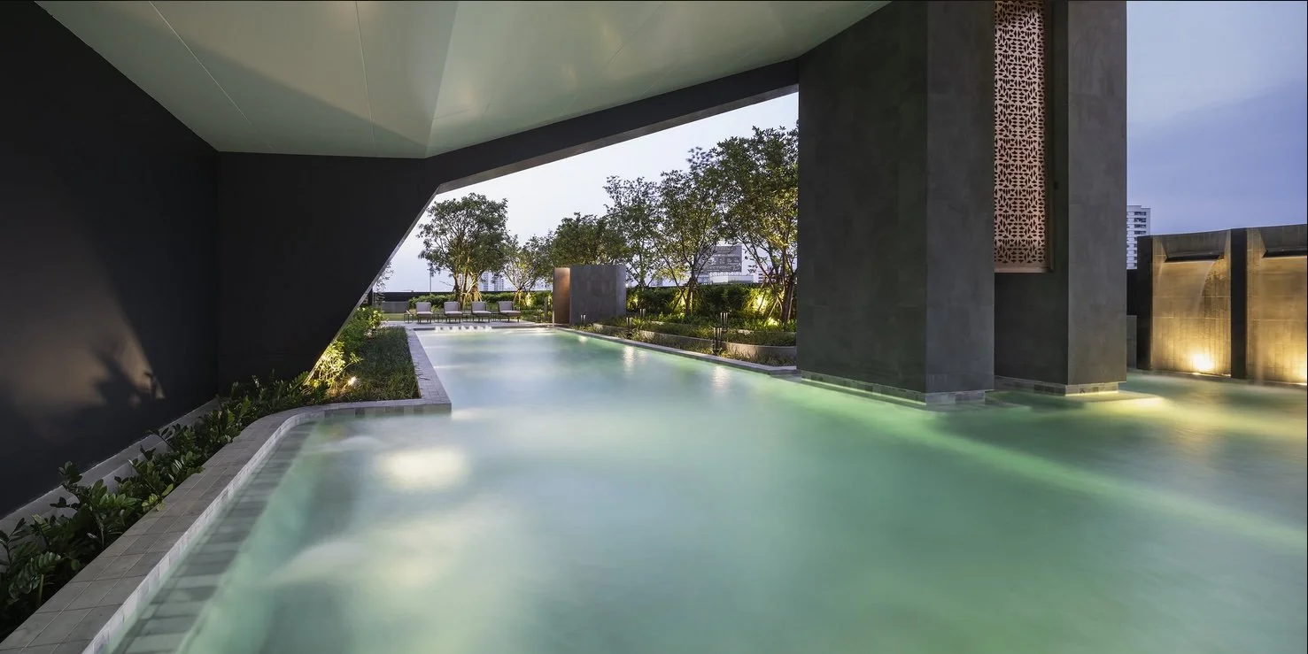 Infinity-edge swimming pool at Coco Parc Dusit-branded luxury condominium in Bangkok.