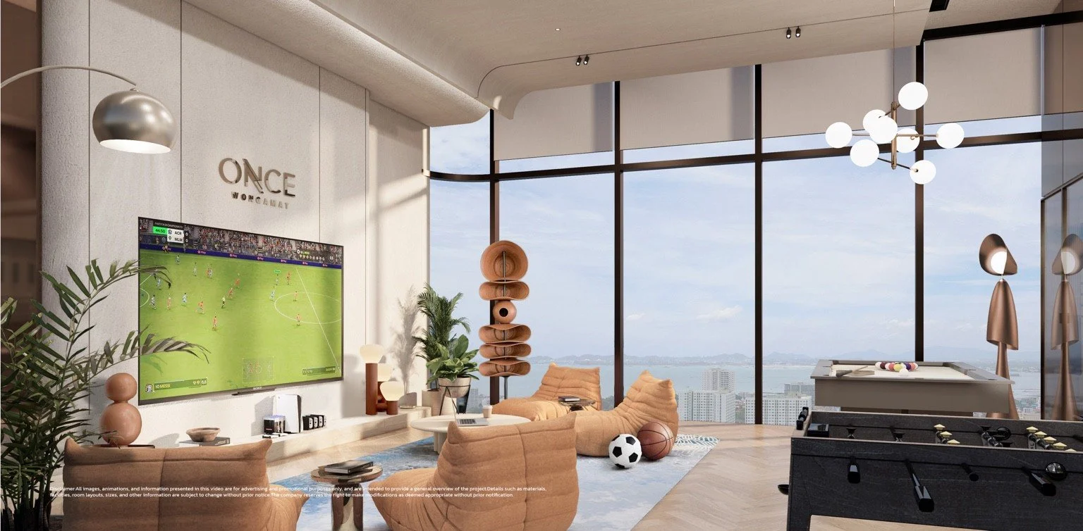 Games room render with large TV, pool table and floor-to-ceiling windows overlooking the sea.