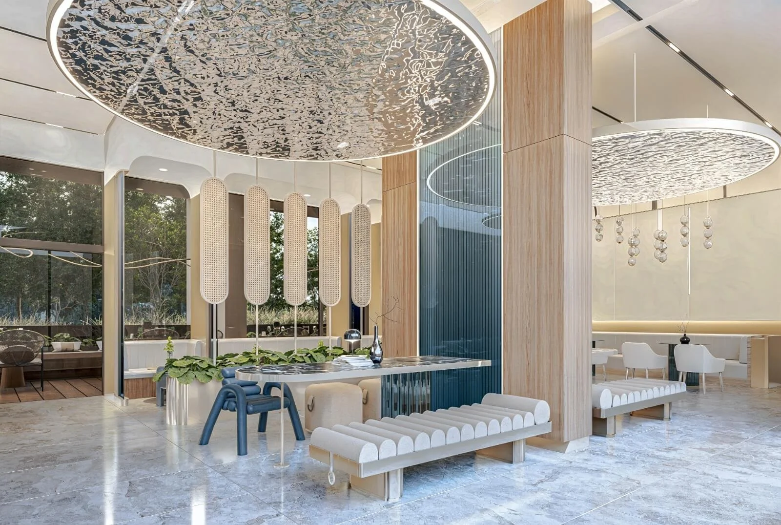 Contemporary lobby lounge at Abov Patong, featuring sculptural lighting, designer seating, and a modern reception area