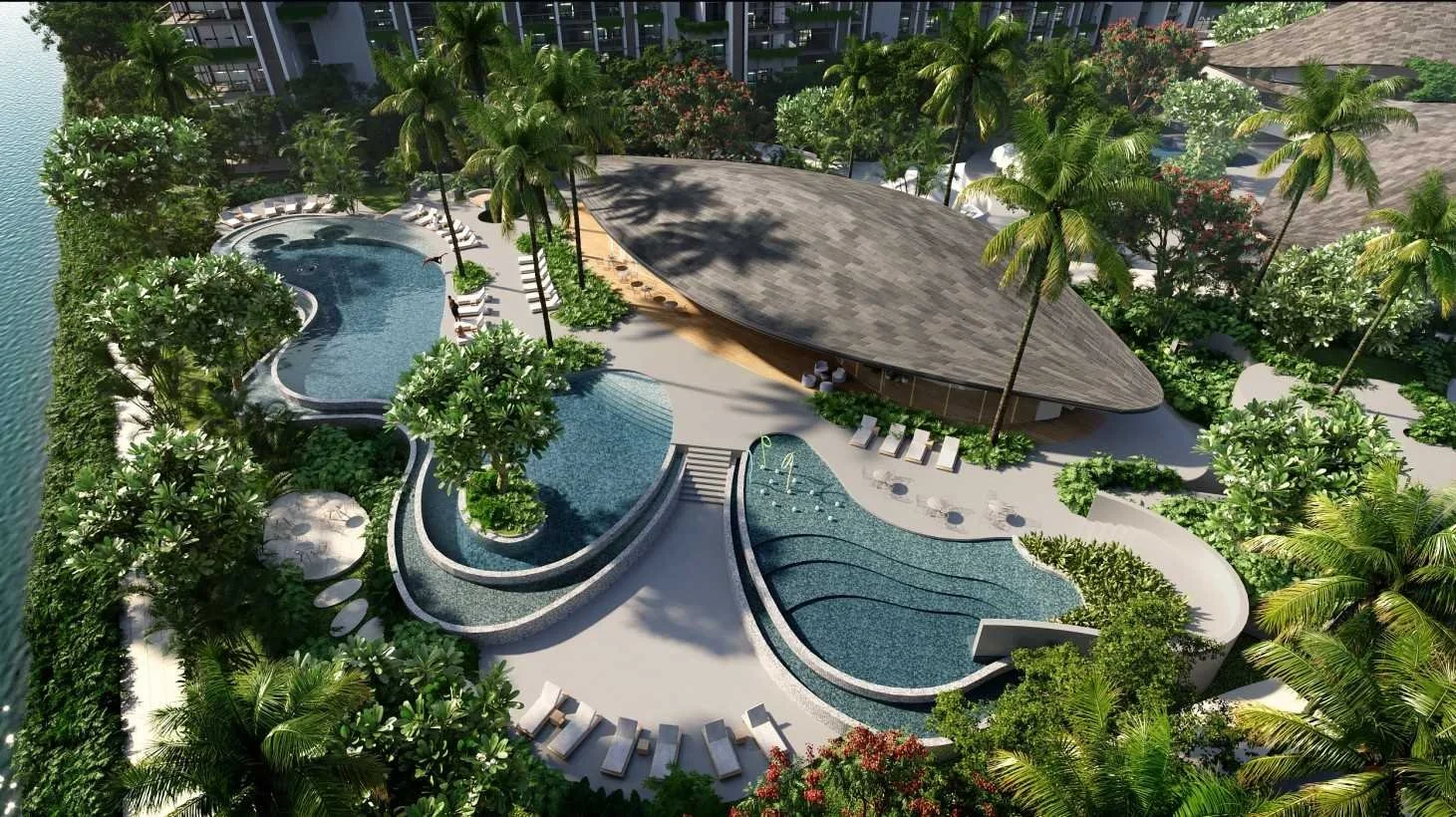 Aerial view of Gardens of Eden Phuket pool and clubhouse pavilion, showing curved pools, landscaped gardens and low-rise luxury residences.