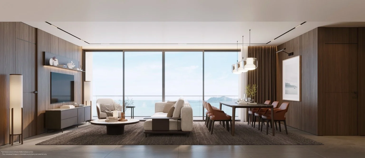 Open-plan living and dining area with sea view at The Panora Estuaria.