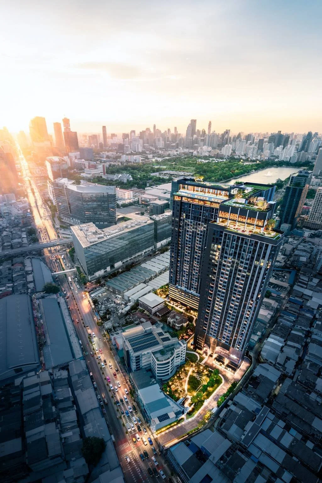 Aerial view of Life Rama 4 – Asoke condominium tower in central Bangkok at sunset.