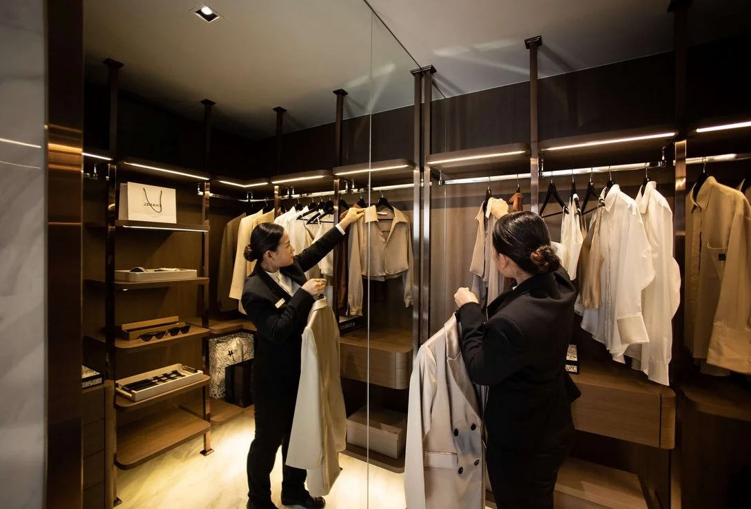 Dusit concierge providing personalised butler service at Coco Parc luxury condominium in Bangkok.