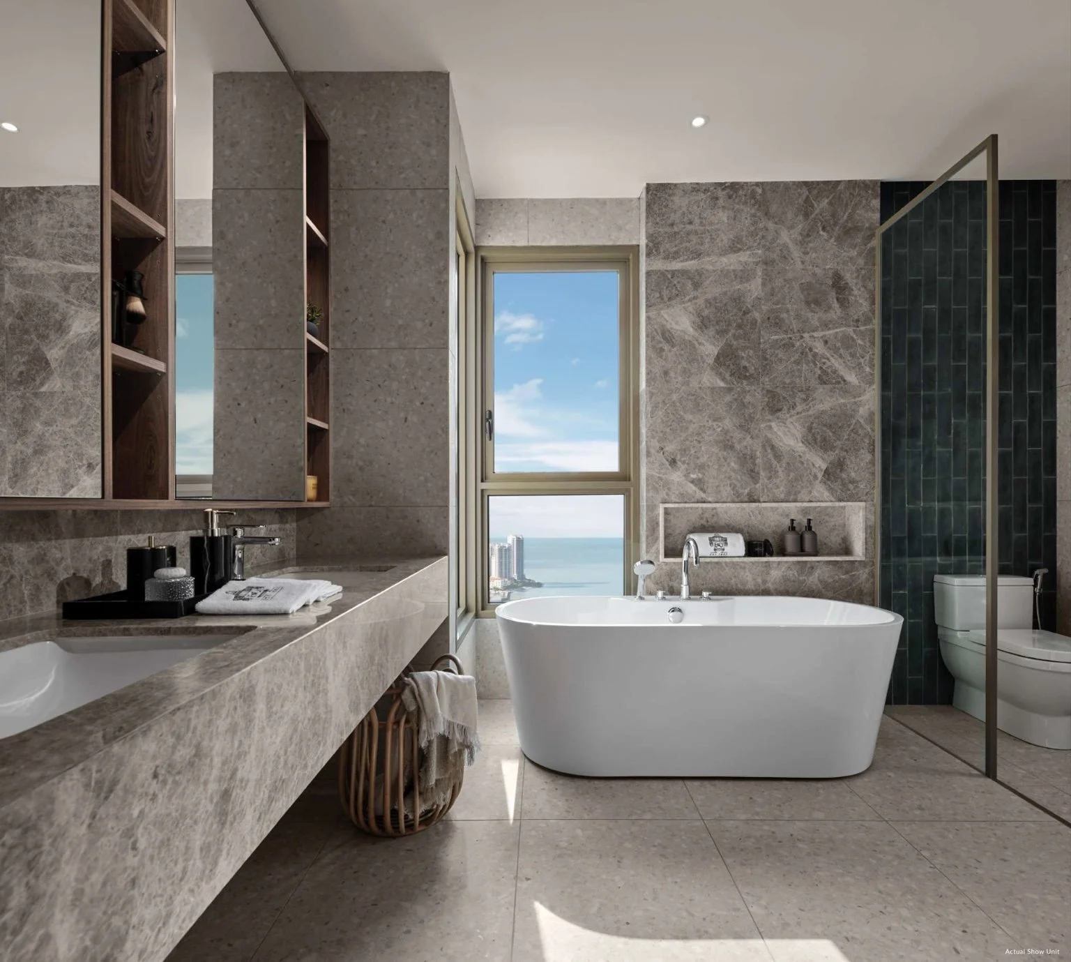 Master bathroom at The Lume by E&O with freestanding bathtub, stone finishes and sea views.