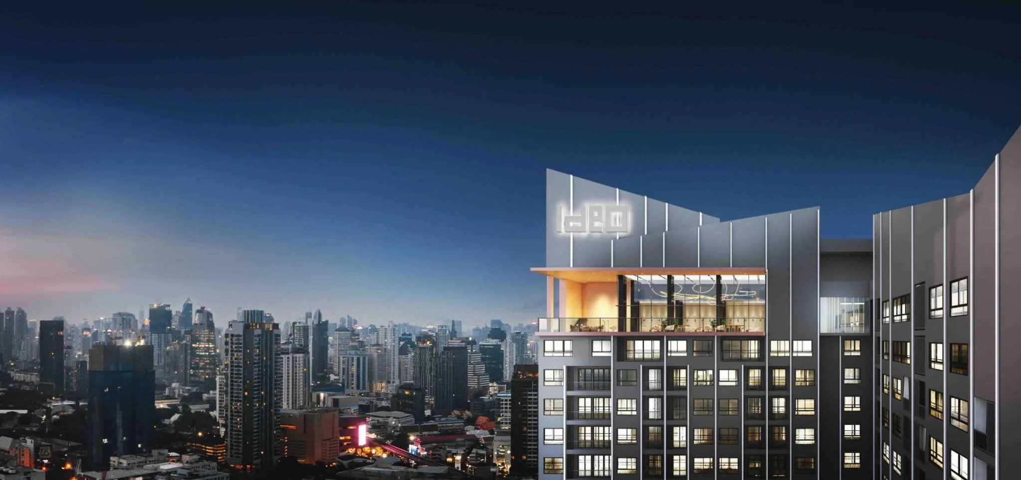 Ideo Sukhumvit Rama 4 Bangkok – city skyline backdrop at dusk from high-rise development.