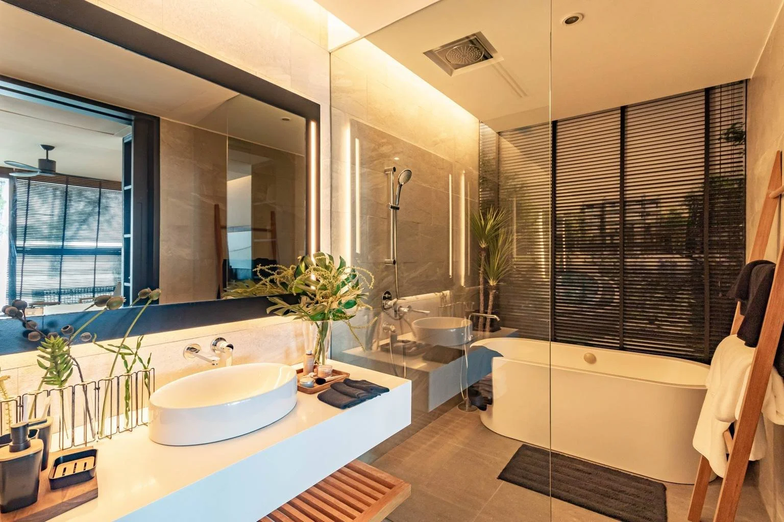 Luxury bathroom in studio residence with freestanding bath, shower and sink basin at MGallery Residences MontAzure.