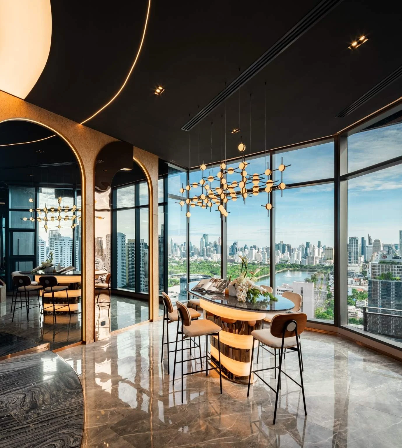 City skyline and Benjakitti Park views from Life Rama 4 Asoke upper floors.