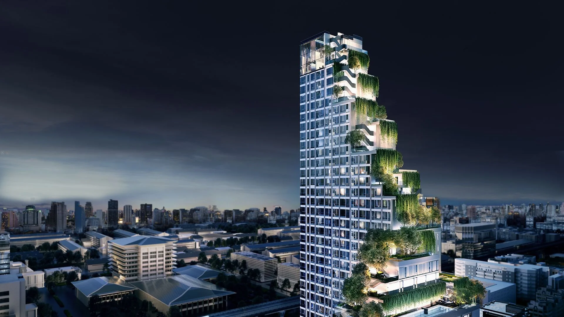 Park Origin Phayathai Bangkok external view at night with city skyline.