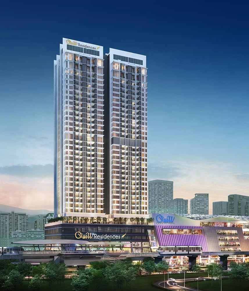 Night view of Quill Residences twin-tower facade illuminated above Quill City Mall.
