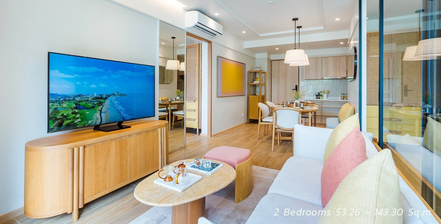 SASA Hua Hin two-bedroom condo with open-plan living, dining and kitchen areas.
