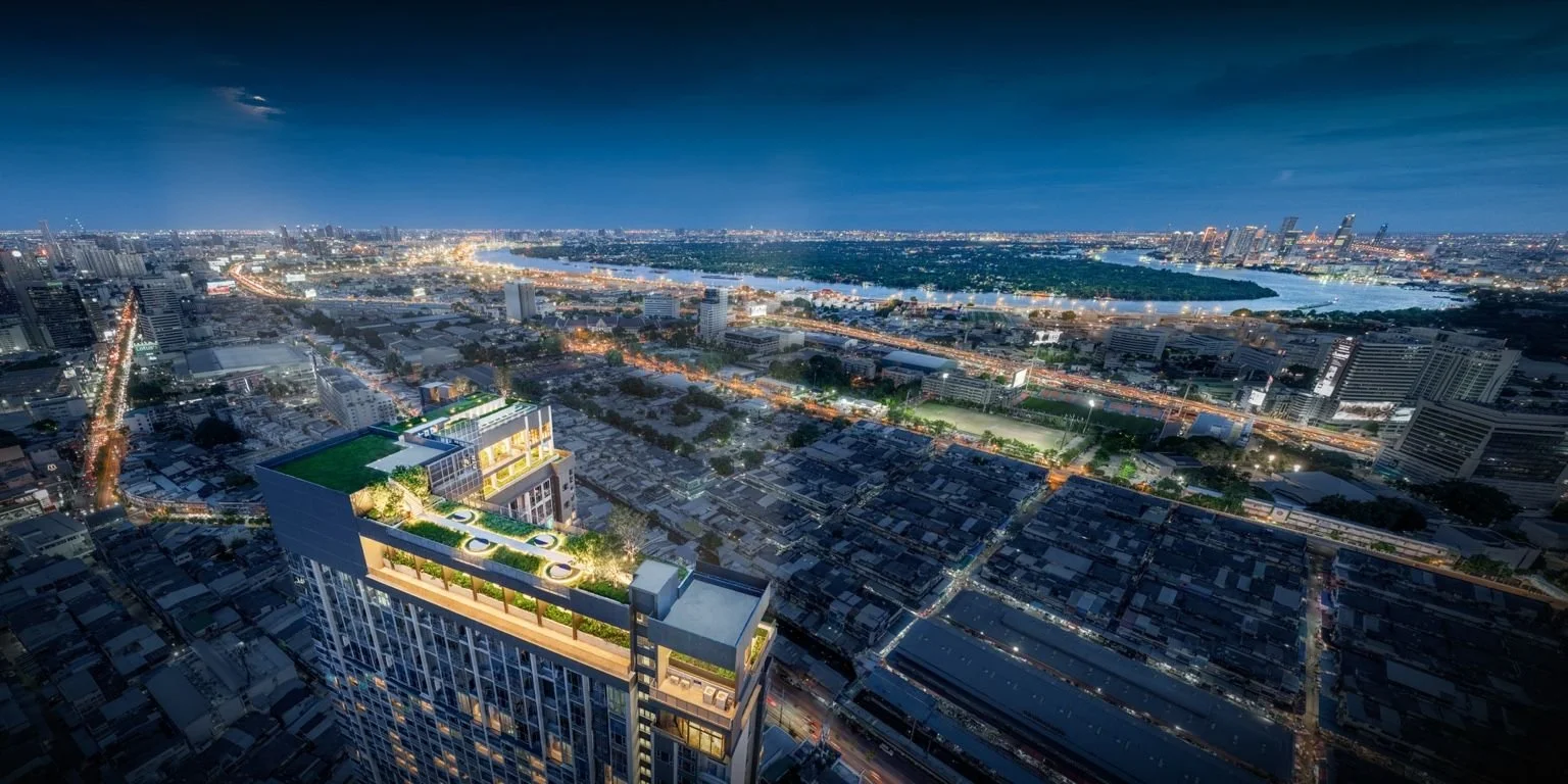 Night skyline view from Life Rama 4 – Asoke overlooking Bang Kachao and the Chao Phraya River.