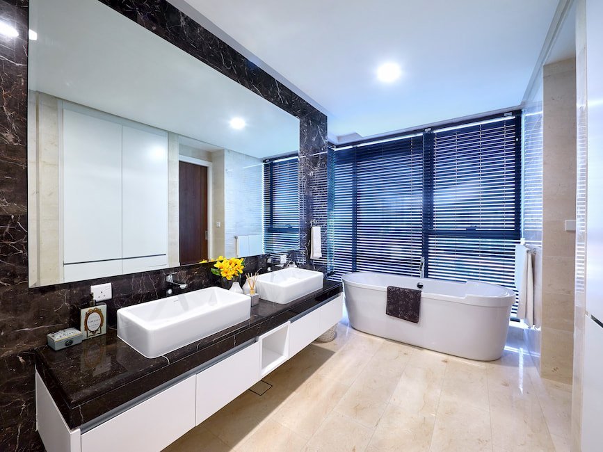 Luxury bathroom at The Astaka Johor Bahru with freestanding bathtub and twin vanity.