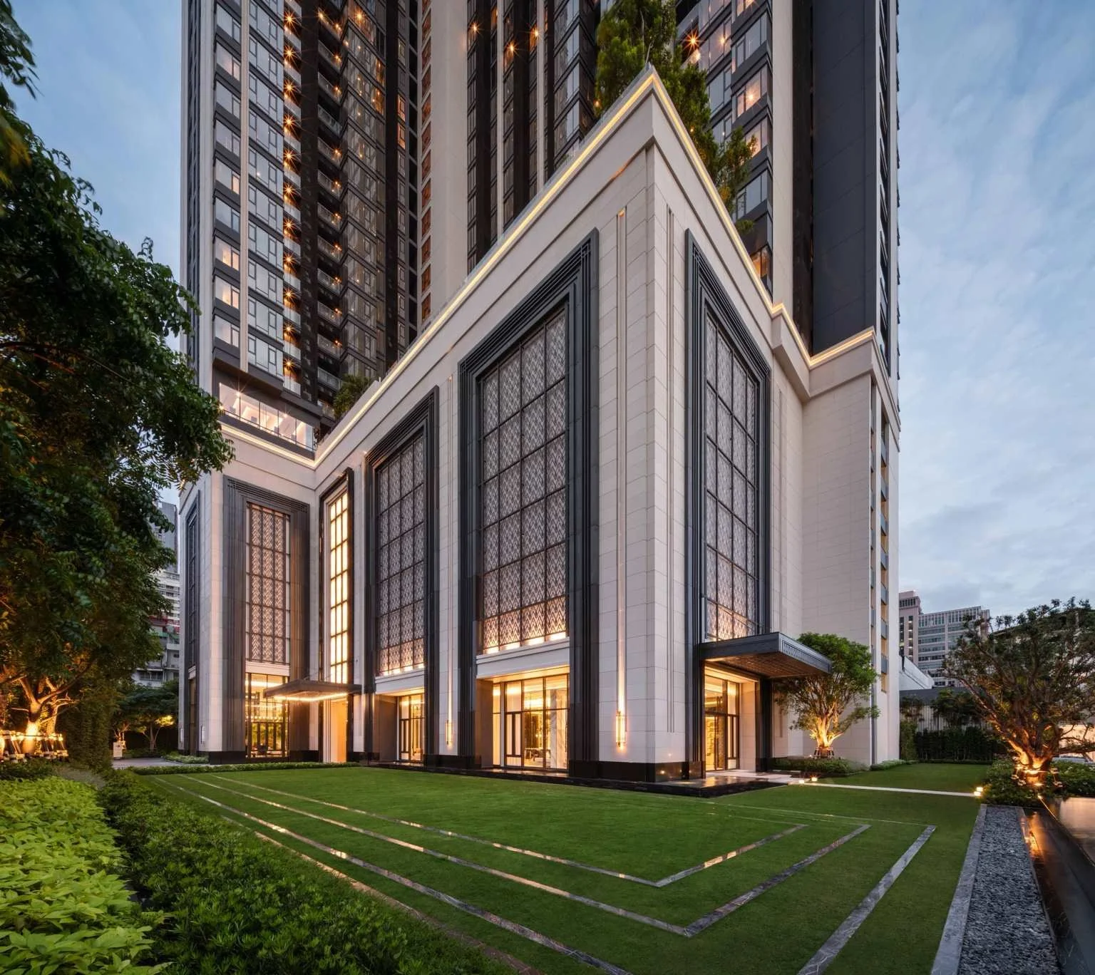 Exterior elevation at The Address Siam–Ratchathewi with landscaped gardens, architectural façade and double-height glazing.