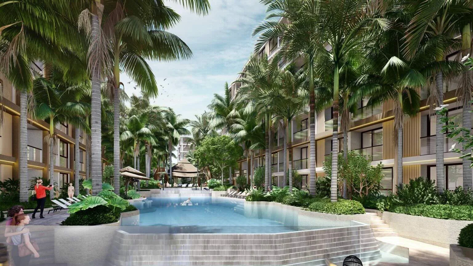 Central swimming pool courtyard surrounded by landscaped greenery at VIP Tropika Phuket.