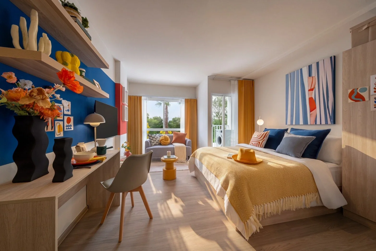 Studio bedroom interior at Hub Hua Hin with colourful furnishings and natural light.