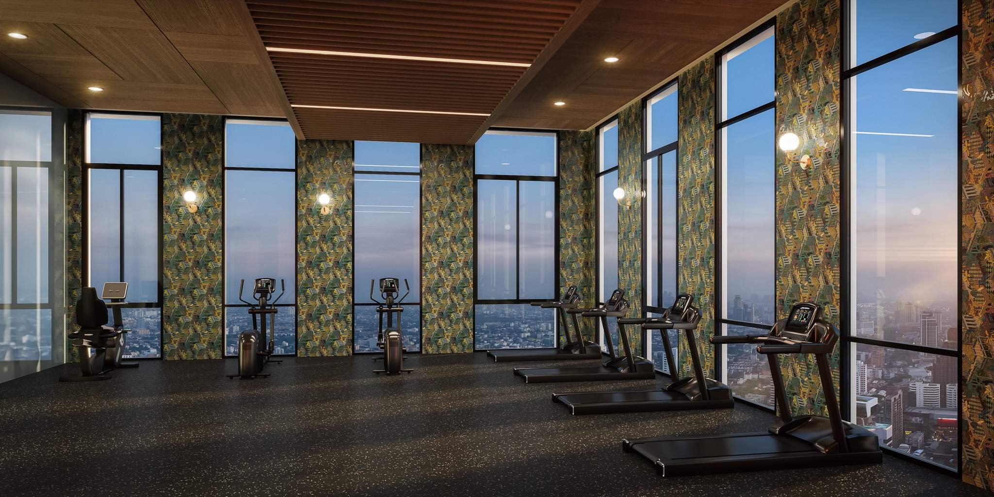 Cloud gym at Noble Form Thonglor with floor-to-ceiling windows and Bangkok city views.