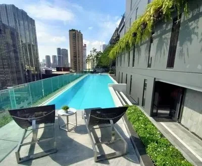 Outdoor swimming pool deck at Park Origin Phayathai condominium Bangkok.