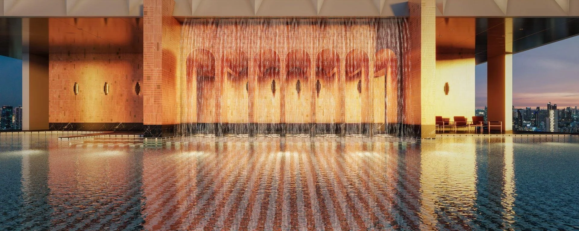 Sky lagoon swimming pool with waterfall feature at Noble Form Thonglor overlooking Bangkok skyline.