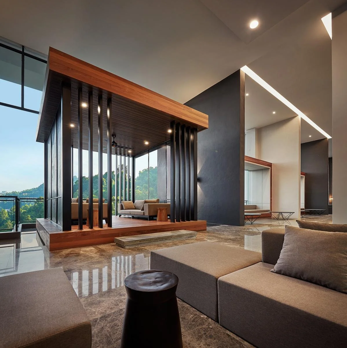 Waiting lounge at Alila² Penang with contemporary seating, high ceilings and landscaped outlook.