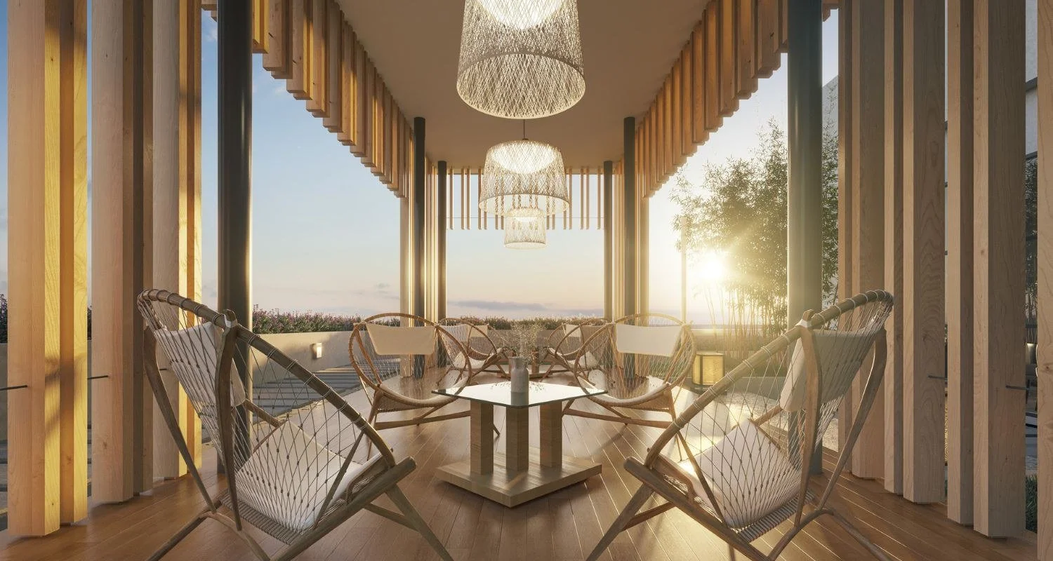 Zen pavilion seating area at Waterstone Penang with warm timber finishes and sunset outlook.