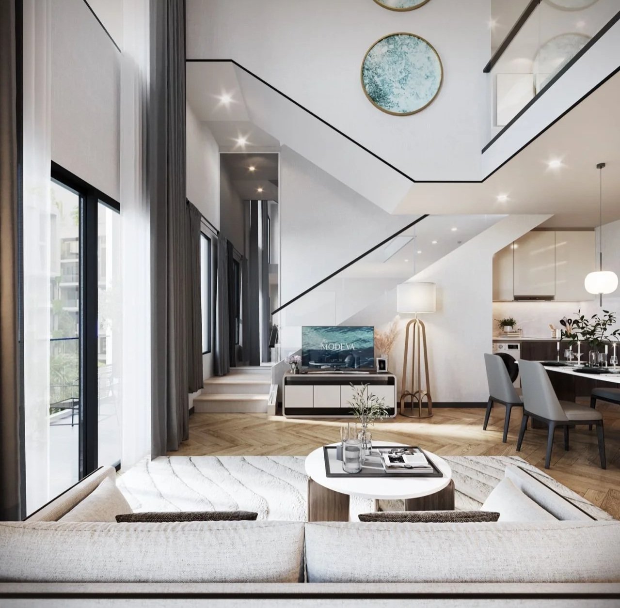 2 Bedroom Duplex licing area with TV and stairs behind it.