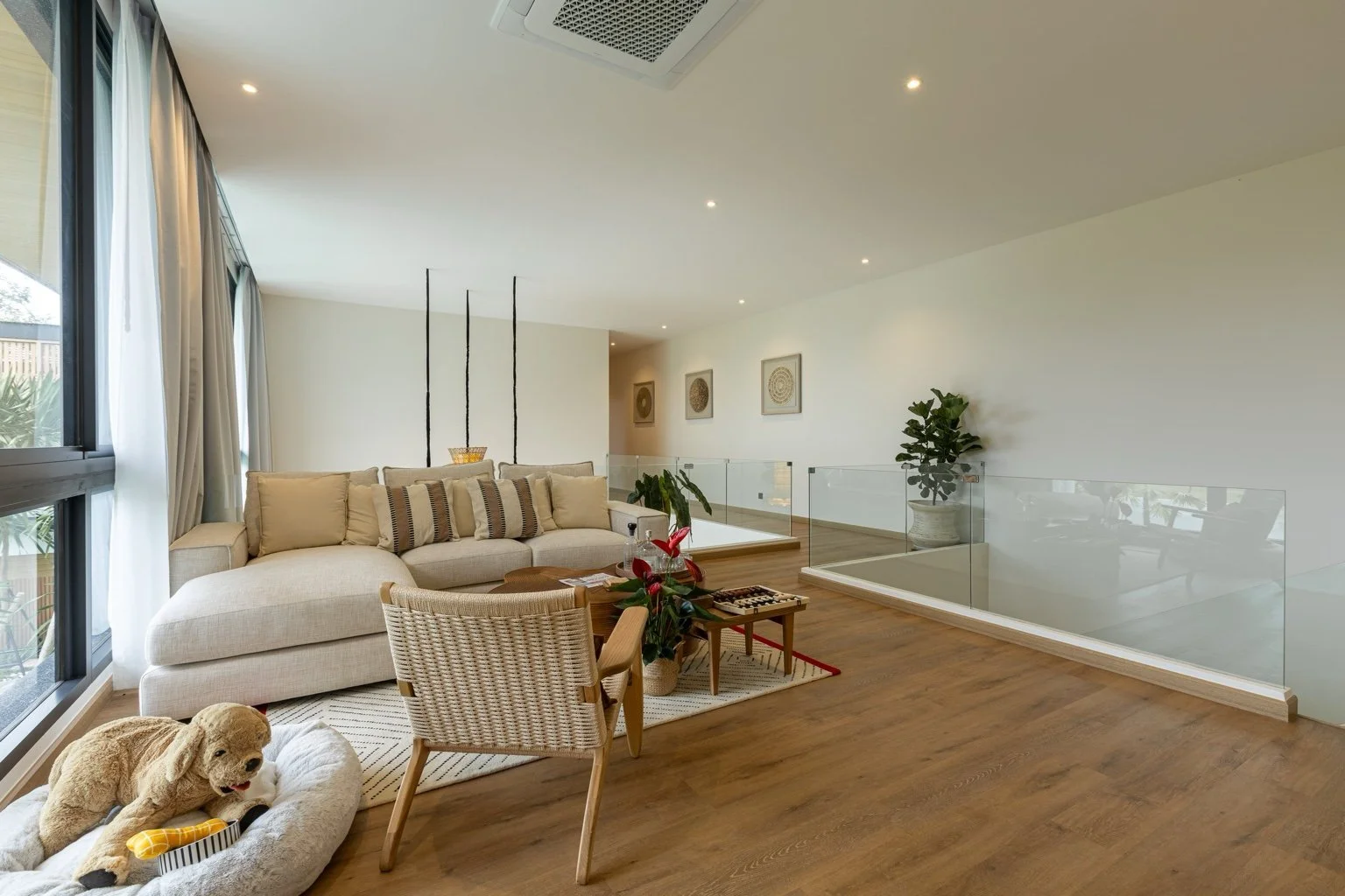 Spacious upstairs living area at Mouana Grande Chalong Bay villa with modern tropical interiors.